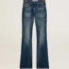 Γυναικείο τζιν με bootcut γραμμή, vintage πλύση και μεταλλικές λεπτομέρειες