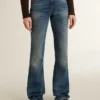 Γυναικείο τζιν με bootcut γραμμή, vintage πλύση και μεταλλικές λεπτομέρειες