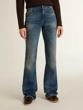 Γυναικείο τζιν με bootcut γραμμή, vintage πλύση και μεταλλικές λεπτομέρειες