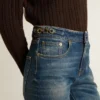 Γυναικείο τζιν με bootcut γραμμή, vintage πλύση και μεταλλικές λεπτομέρειες